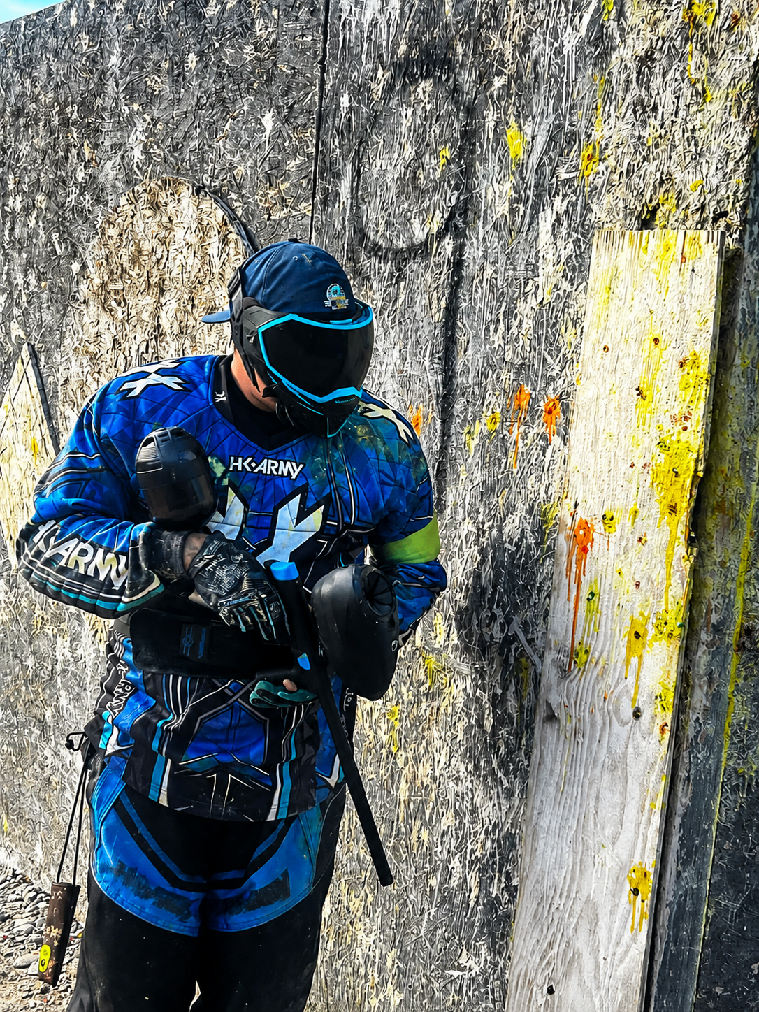 AZ Streetz player loading a marker beside a splattered barricade